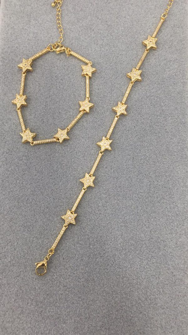 Brazalete estrella con zirconias dorado